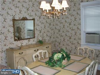 320 Lippincott Avenue Riverside, NJ 08075 - Photo 2 of 12 a bathroom with a sink a mirror and a toilet