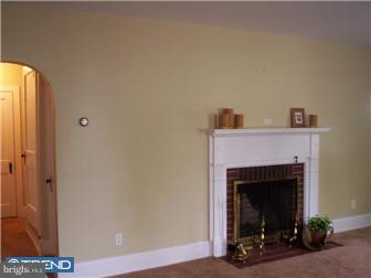 320 Lippincott Avenue Riverside, NJ 08075 - Photo 7 of 12 a view of a livingroom with a fireplace and a window