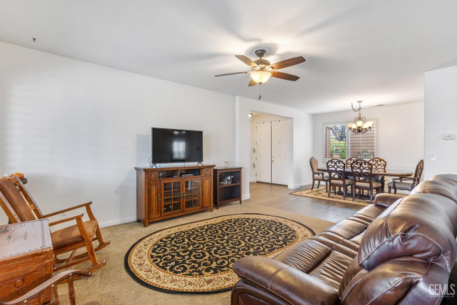 Undisclosed Address Bakersfield, CA 93312 - Photo 13 of 45 a living room with furniture and a flat screen tv
