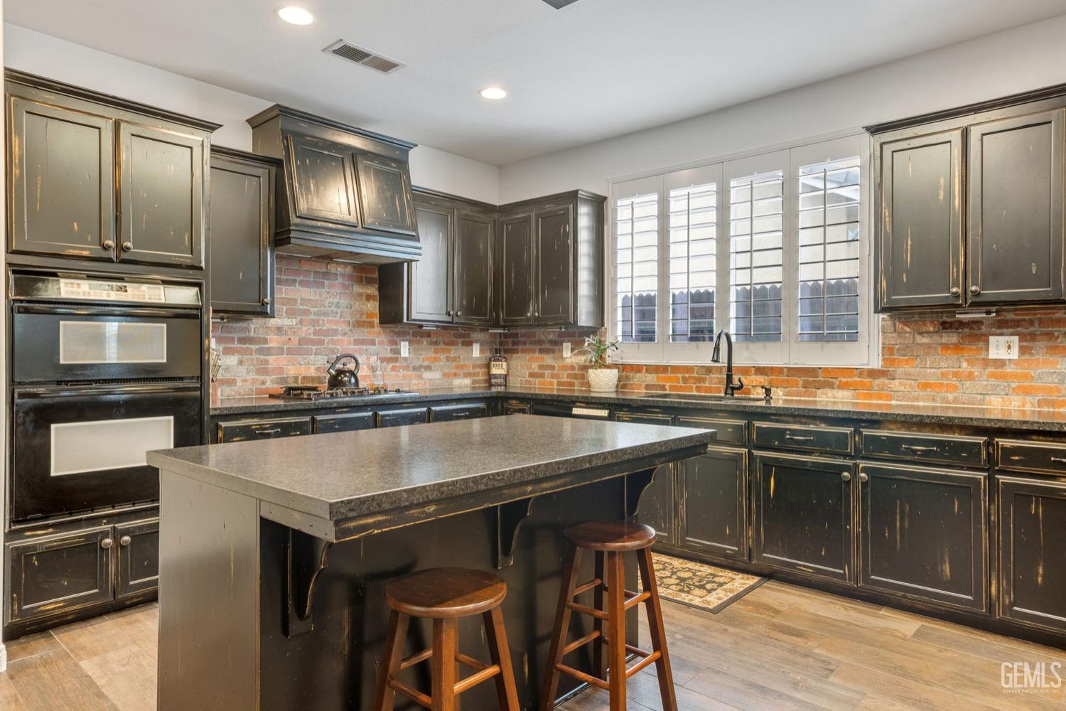 Undisclosed Address Bakersfield, CA 93312 - Photo 19 of 45 a kitchen with stainless steel appliances granite countertop a sink stove and refrigerator