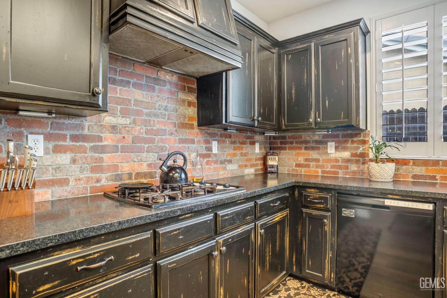 Undisclosed Address Bakersfield, CA 93312 - Photo 20 of 45 a kitchen with stainless steel appliances granite countertop a sink stove and cabinets