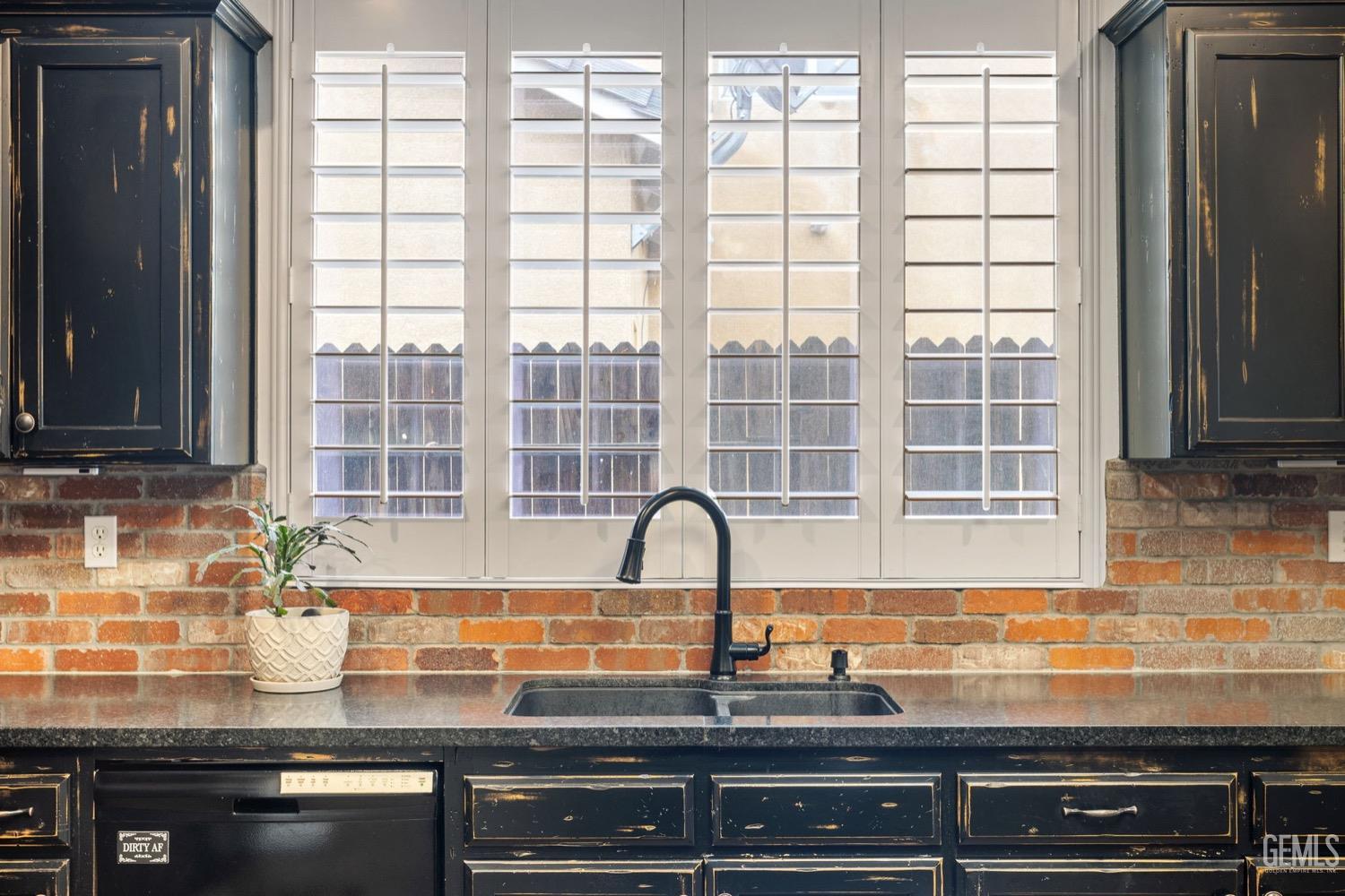 Undisclosed Address Bakersfield, CA 93312 - Photo 22 of 45 a kitchen with granite countertop a sink and a window