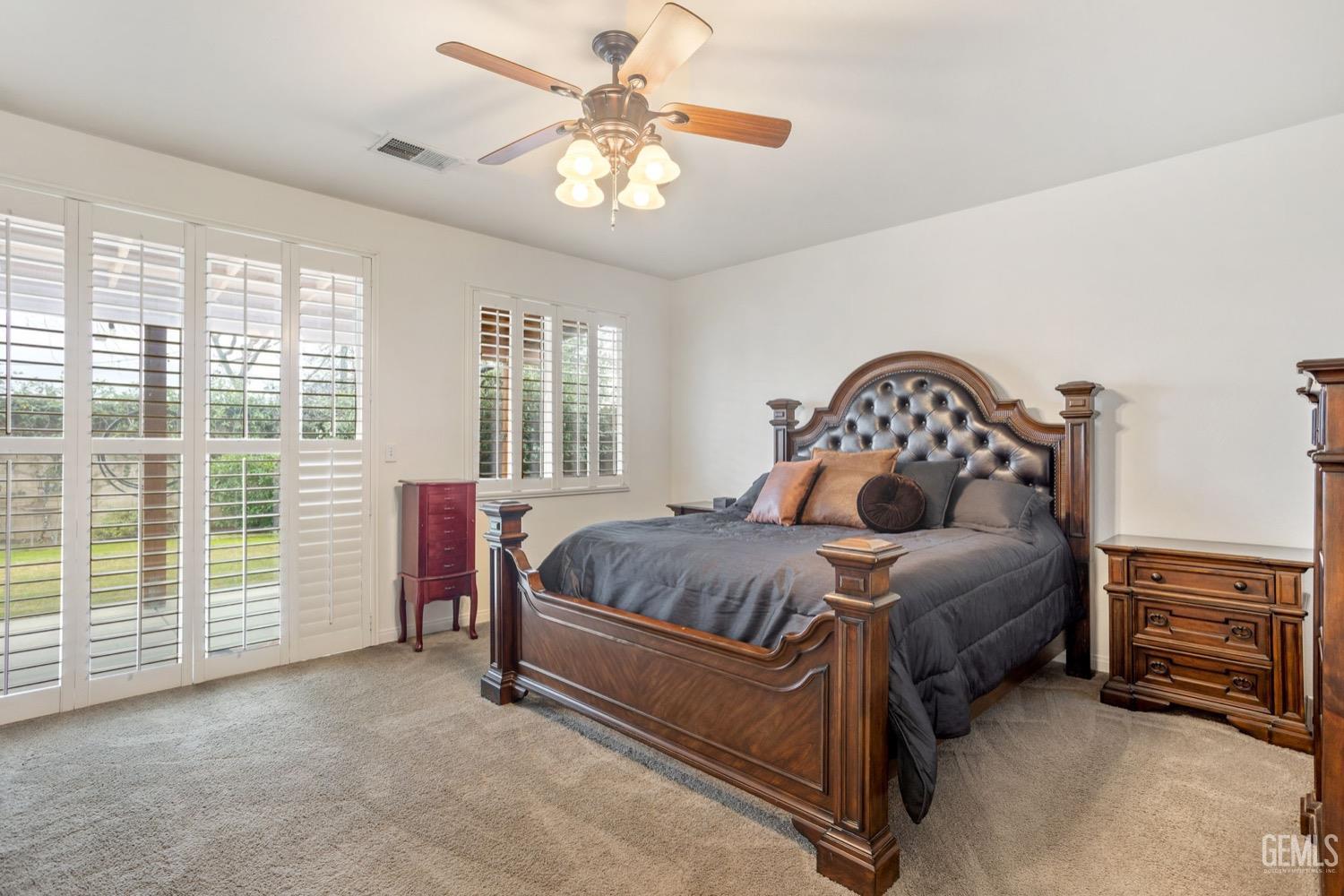Undisclosed Address Bakersfield, CA 93312 - Photo 29 of 45 a bedroom with a bed a dresser next to a window