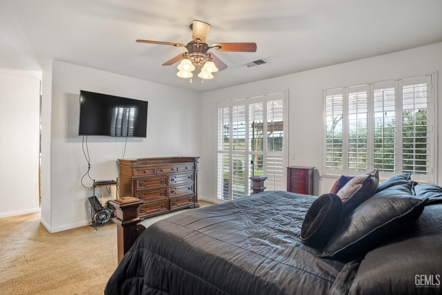 Undisclosed Address Bakersfield, CA 93312 - Photo 32 of 45 a bedroom with a bed and a flat screen tv