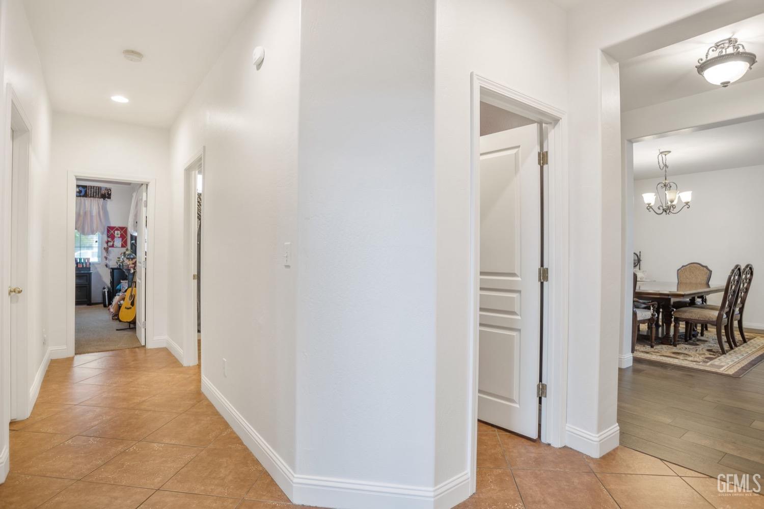 Undisclosed Address Bakersfield, CA 93312 - Photo 36 of 45 a view of a hallway with dining area view