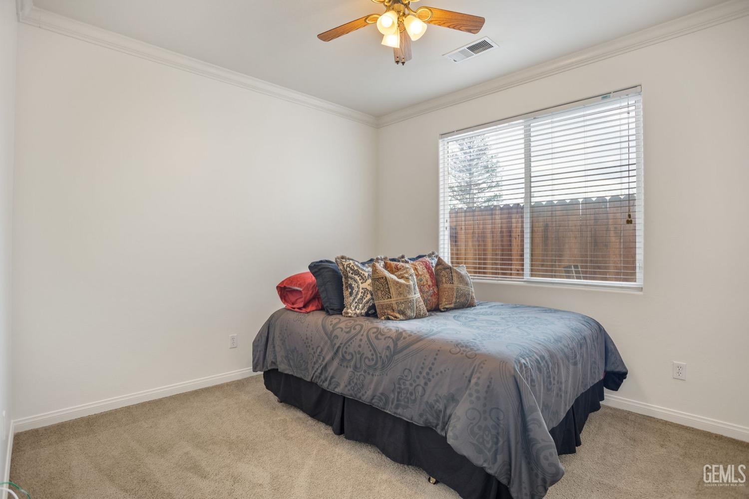 Undisclosed Address Bakersfield, CA 93312 - Photo 38 of 45 a bedroom with a bed and a chandelier