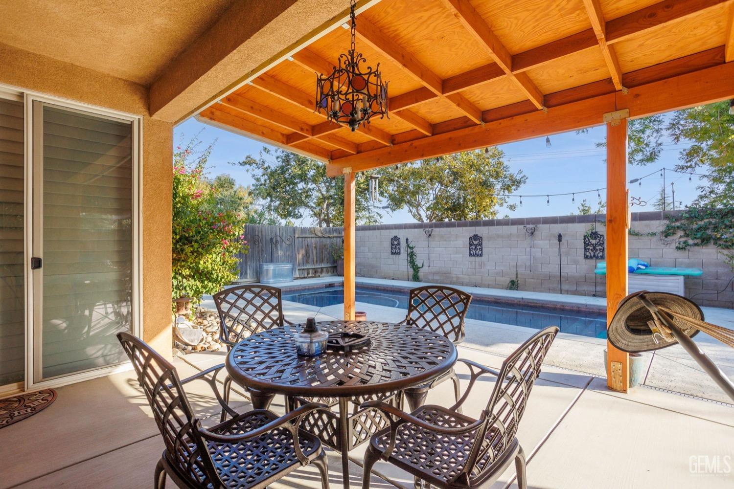 Undisclosed Address Bakersfield, CA 93312 - Photo 40 of 45 a view of a patio with a table chairs and a table