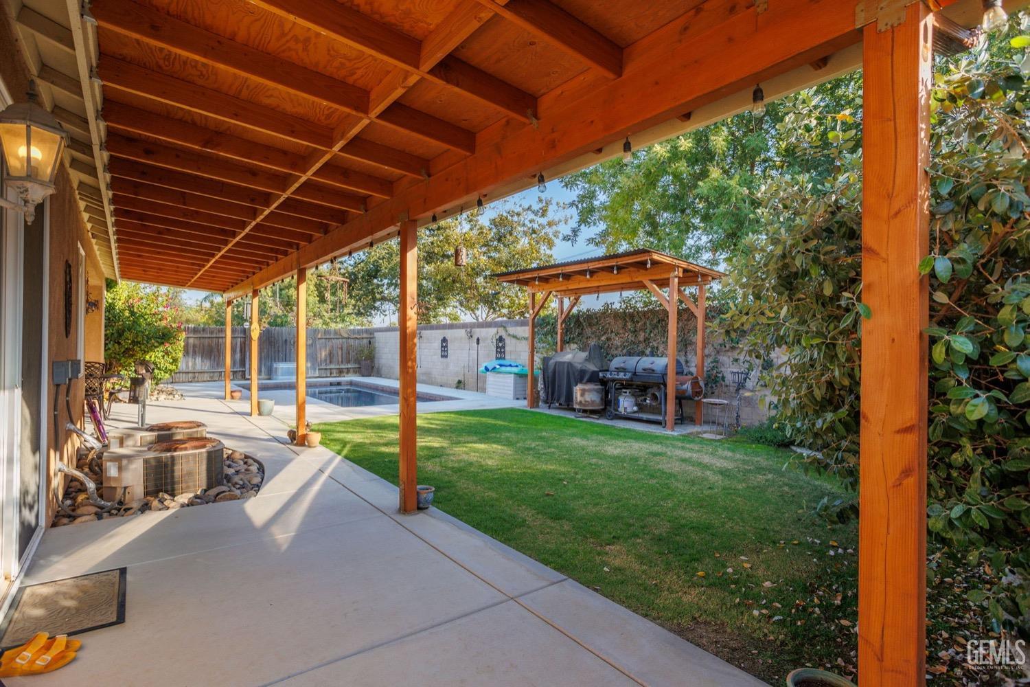 Undisclosed Address Bakersfield, CA 93312 - Photo 41 of 45 a view of a backyard with garden and patio