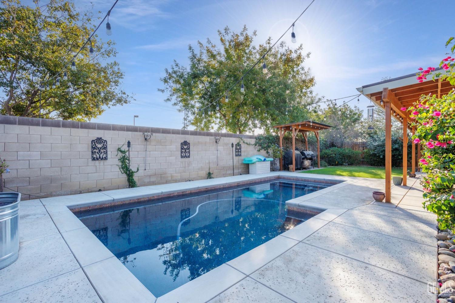 Undisclosed Address Bakersfield, CA 93312 - Photo 44 of 45 a view of backyard with swimming pool and furniture