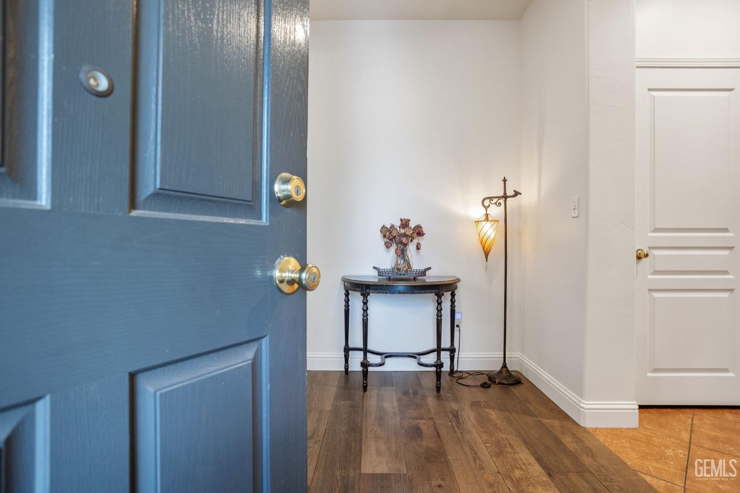 Undisclosed Address Bakersfield, CA 93312 - Photo 7 of 45 a view of dining room with furniture and wooden floor
