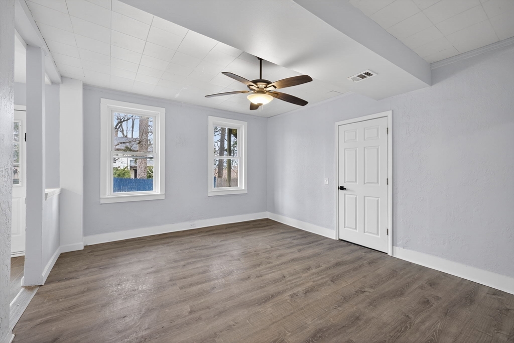 77 Off Hamilton Street Southbridge, MA 01550 - Photo 11 of 42 wooden floor in an empty room with a window