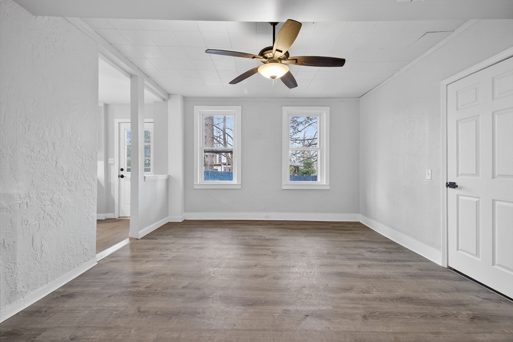 77 Off Hamilton Street Southbridge, MA 01550 - Photo 13 of 42 wooden floor in an empty room with a window