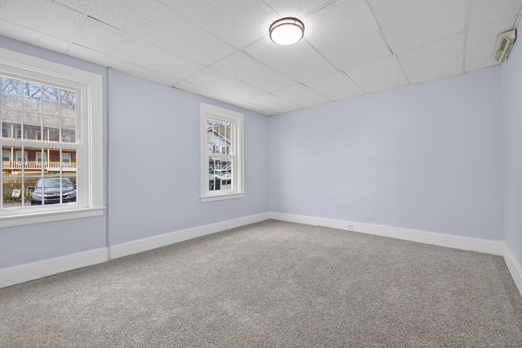 77 Off Hamilton Street Southbridge, MA 01550 - Photo 14 of 42 an empty room with windows