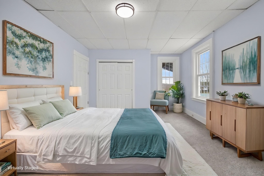 77 Off Hamilton Street Southbridge, MA 01550 - Photo 15 of 42 a spacious bedroom with a large bed and a large mirror