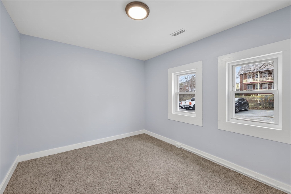 77 Off Hamilton Street Southbridge, MA 01550 - Photo 18 of 42 an empty room with windows