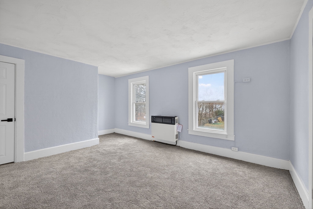 77 Off Hamilton Street Southbridge, MA 01550 - Photo 22 of 42 an empty room with windows and closet