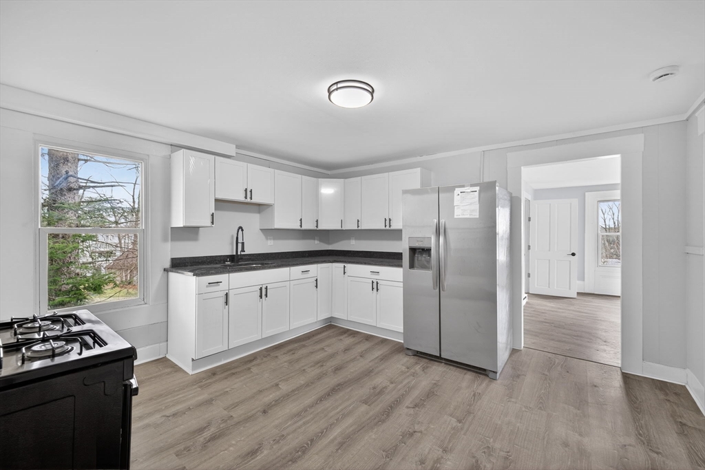 77 Off Hamilton Street Southbridge, MA 01550 - Photo 26 of 42 a kitchen with a stove a sink and a refrigerator