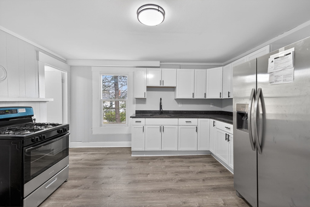 77 Off Hamilton Street Southbridge, MA 01550 - Photo 27 of 42 a kitchen with granite countertop a refrigerator stove and sink