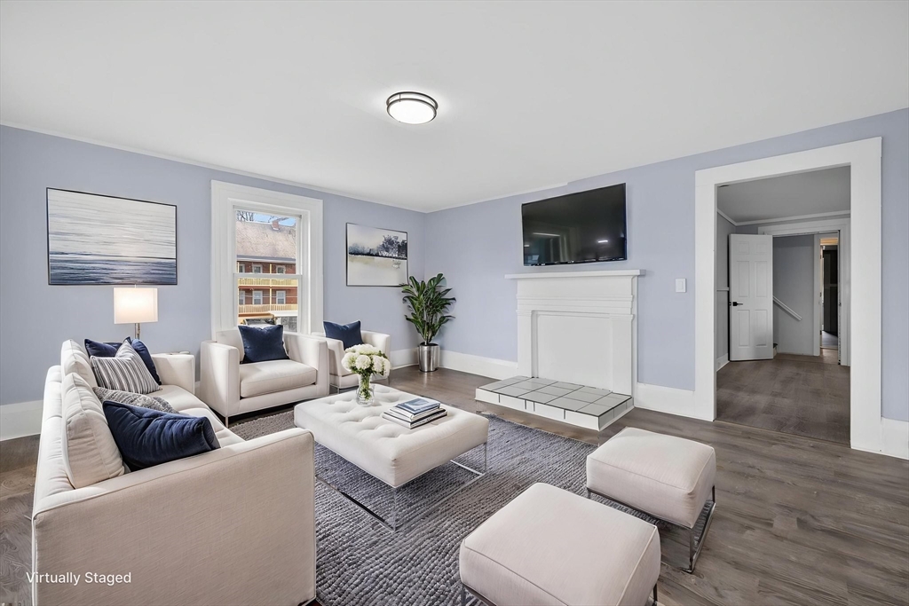 77 Off Hamilton Street Southbridge, MA 01550 - Photo 30 of 42 a living room with furniture a flat screen tv and a large window