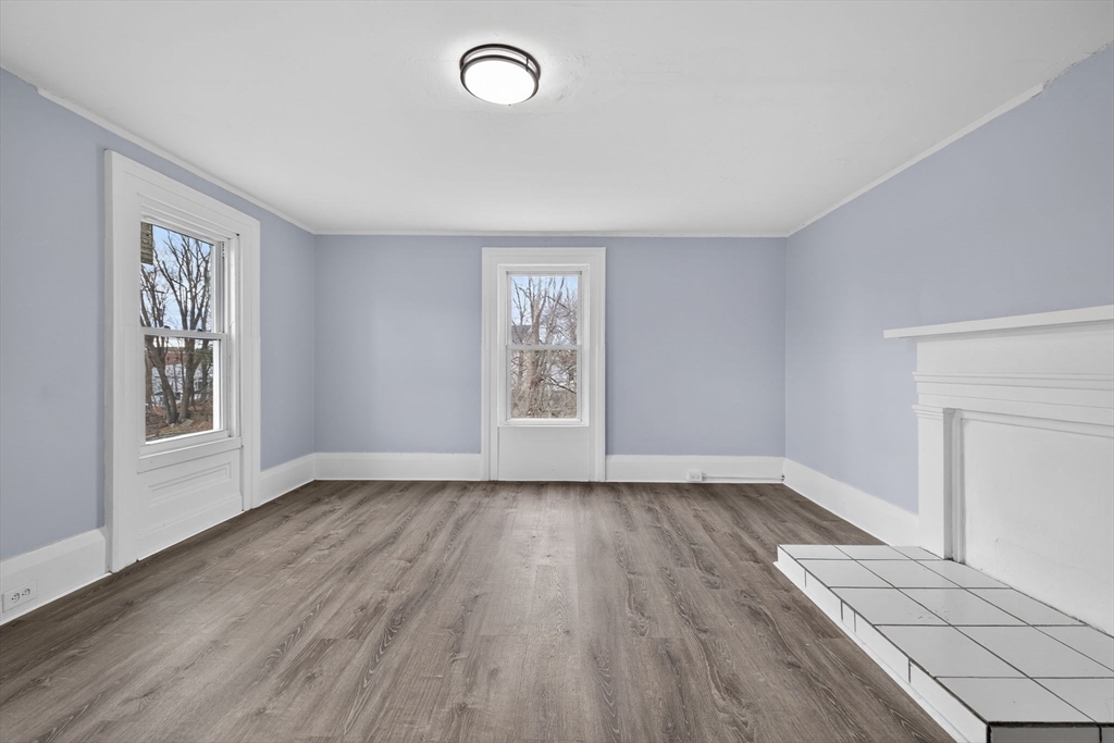 77 Off Hamilton Street Southbridge, MA 01550 - Photo 31 of 42 an empty room with wooden floor and windows