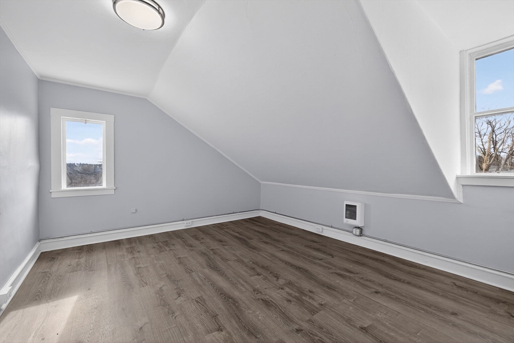 77 Off Hamilton Street Southbridge, MA 01550 - Photo 34 of 42 an empty room with wooden floor and windows