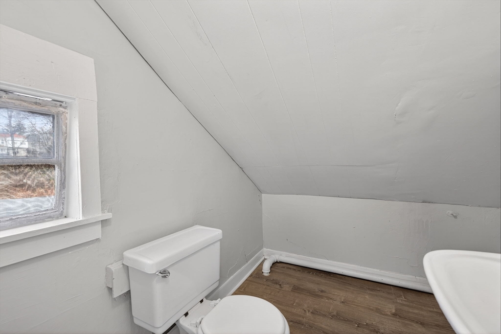 77 Off Hamilton Street Southbridge, MA 01550 - Photo 38 of 42 a white toilet sitting next to a window