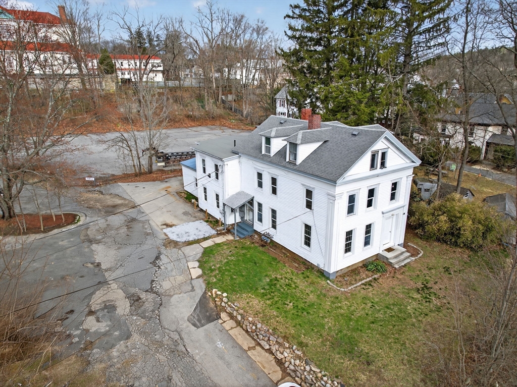 77 Off Hamilton Street Southbridge, MA 01550 - Photo 4 of 42 a view of a house with wooden fence