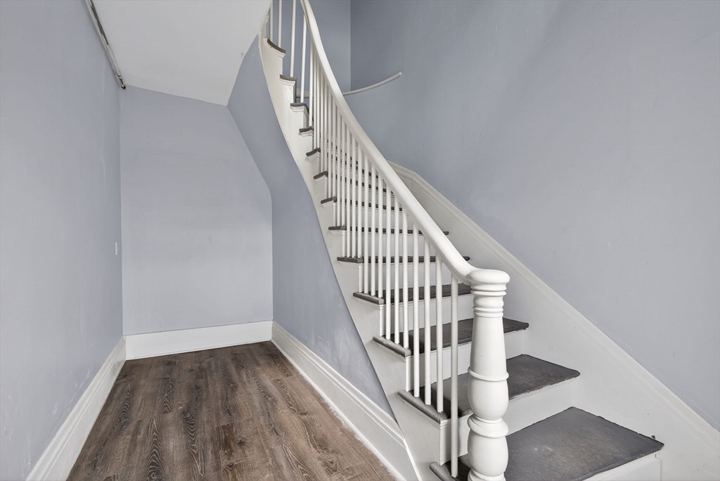 77 Off Hamilton Street Southbridge, MA 01550 - Photo 6 of 42 a view of staircase with wooden floor and white walls