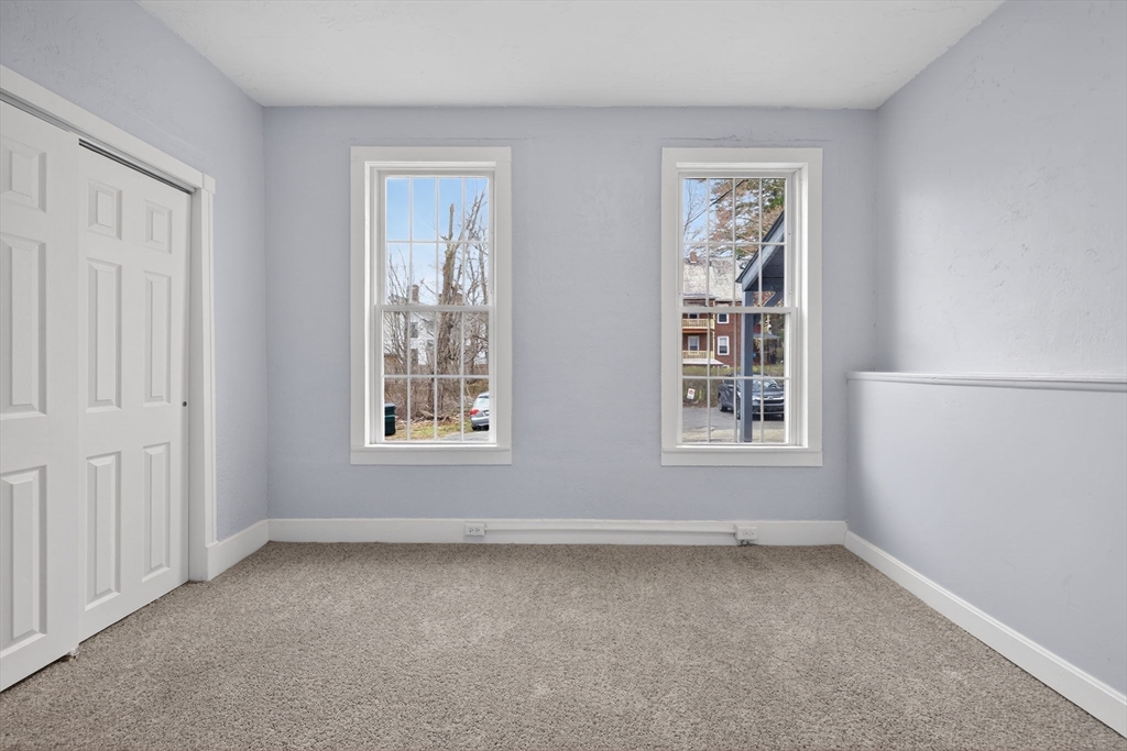 77 Off Hamilton Street Southbridge, MA 01550 - Photo 9 of 42 an empty room with windows