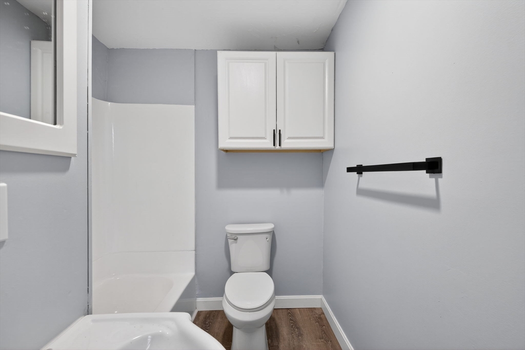 77 Off Hamilton Street Southbridge, MA 01550 - Photo 10 of 42 a white toilet sitting in a bathroom