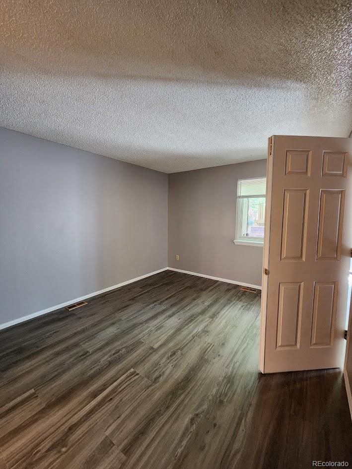 2685 South Dayton Way, Unit 365 Denver, CO 80231 - Photo 13 of 24 wooden floor in an empty room