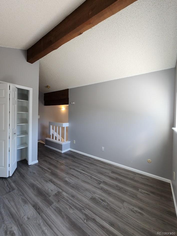 2685 South Dayton Way, Unit 365 Denver, CO 80231 - Photo 15 of 24 a view of an empty room with wooden floor and a window