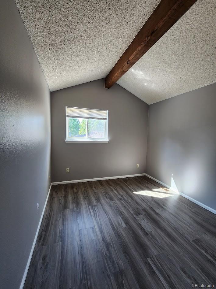 2685 South Dayton Way, Unit 365 Denver, CO 80231 - Photo 16 of 24 an empty room with wooden floor and windows