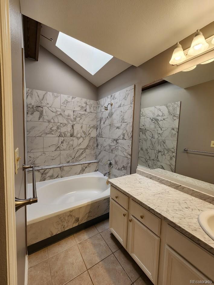 2685 South Dayton Way, Unit 365 Denver, CO 80231 - Photo 19 of 24 a spacious bathroom with a tub sink and shower