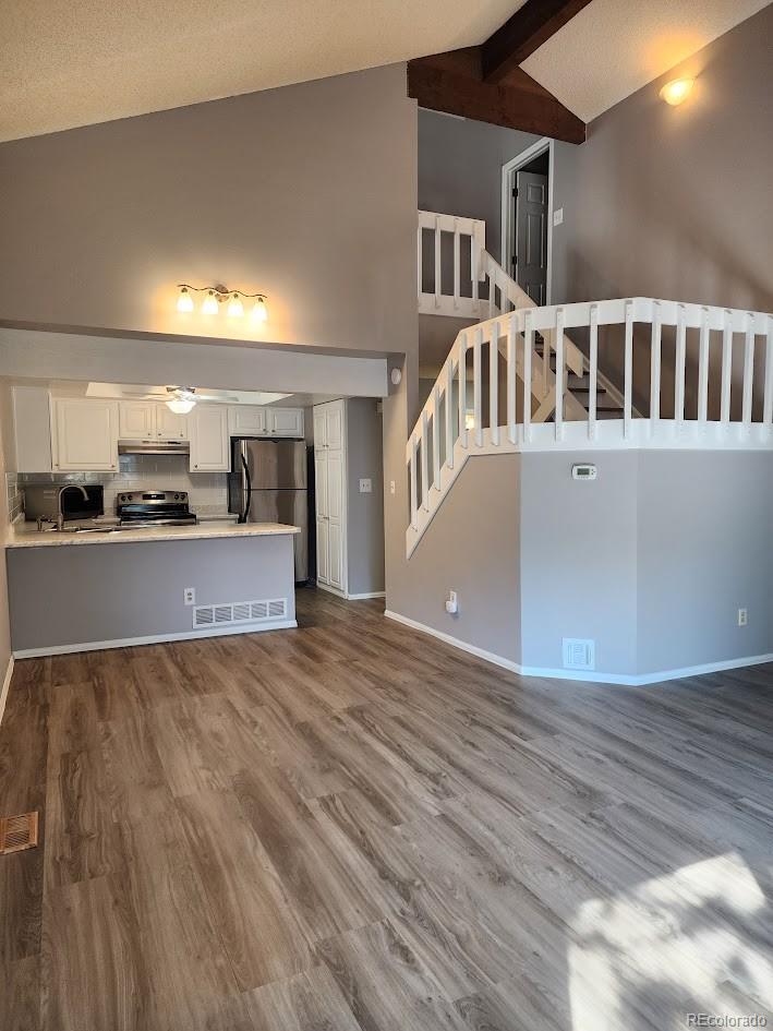 2685 South Dayton Way, Unit 365 Denver, CO 80231 - Photo 5 of 24 a view of a kitchen with a sink and dishwasher