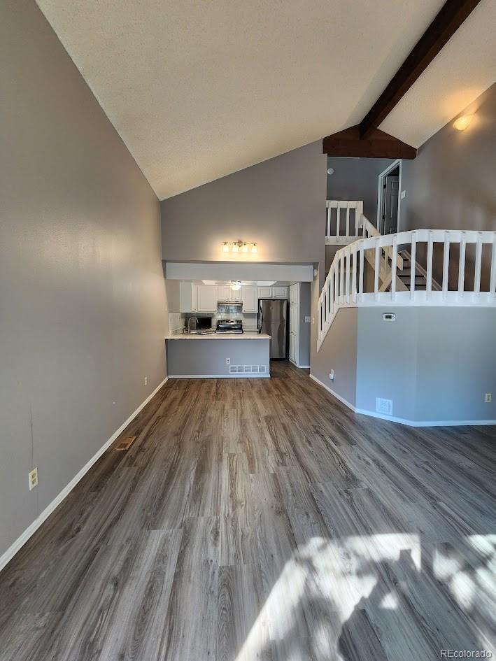 2685 South Dayton Way, Unit 365 Denver, CO 80231 - Photo 7 of 24 a view of main area with wooden floor