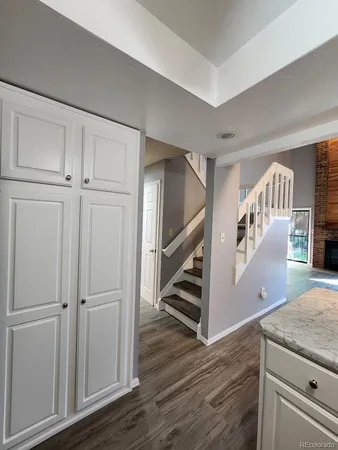 a view of an entryway with wooden floor