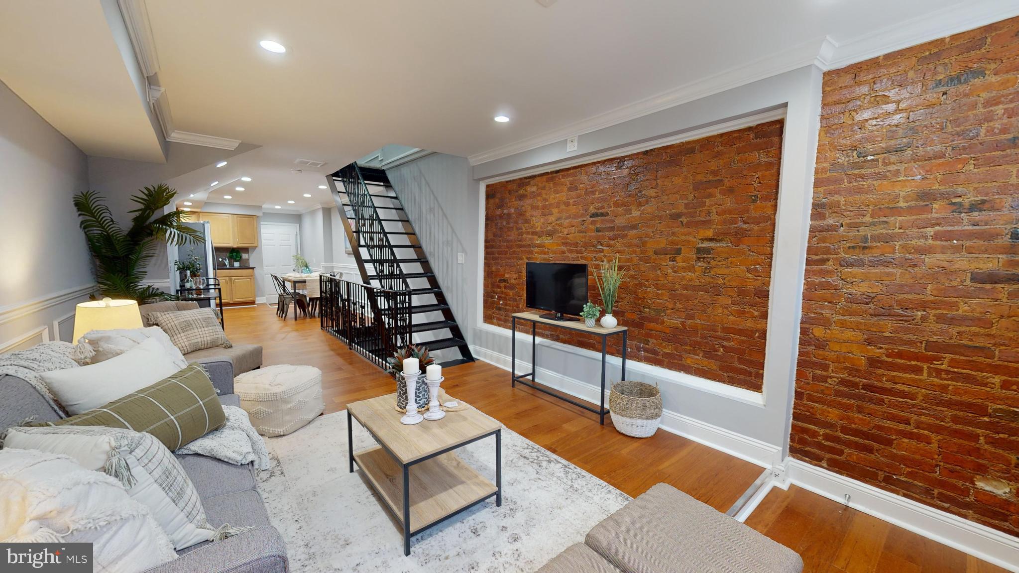 633 Archer Street Baltimore, MD 21230 - Photo 3 of 20 Gorgeous Living Room w/ Exposed Brick Walls