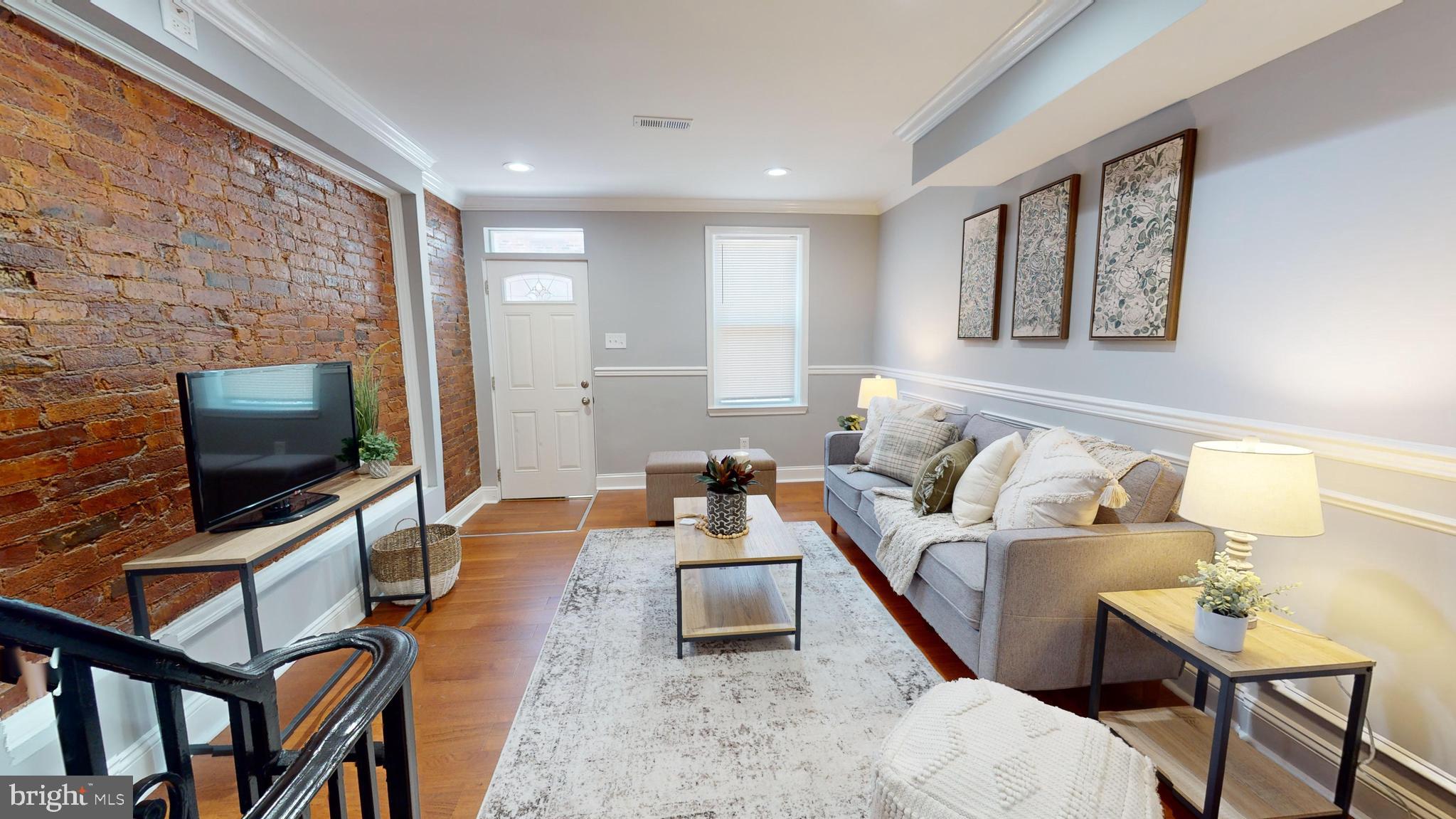 633 Archer Street Baltimore, MD 21230 - Photo 4 of 20 Gorgeous Living Room w/ Exposed Brick Walls