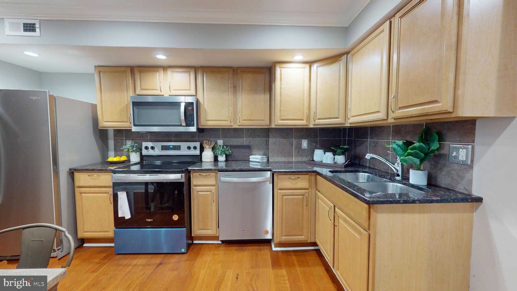 633 Archer Street Baltimore, MD 21230 - Photo 6 of 20 Kitchen w/ New Appliances and Granite Counters