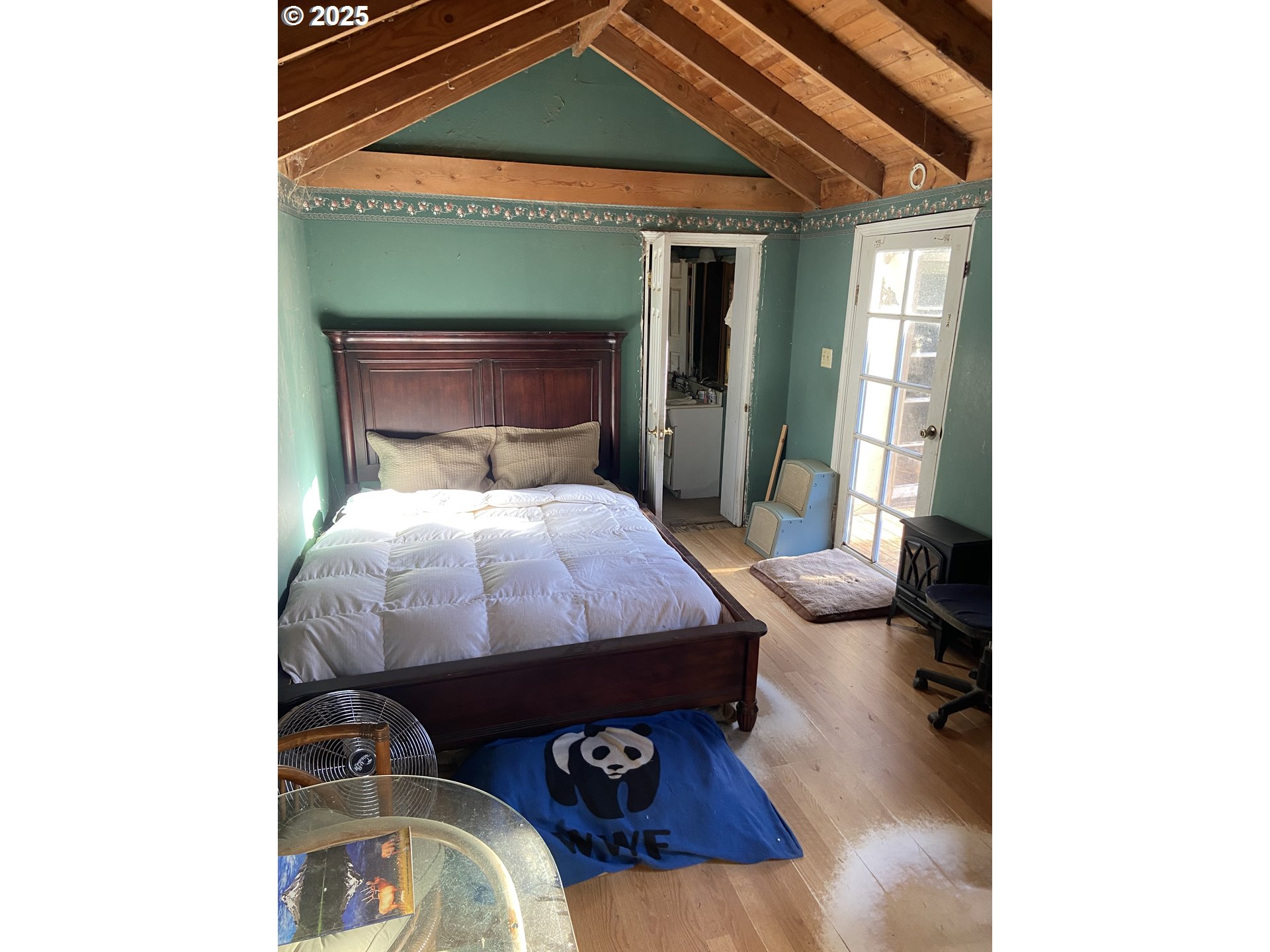 4571 Perpetua Street Florence, OR 97439 - Photo 2 of 13 a bed sitting in a bedroom next to a window