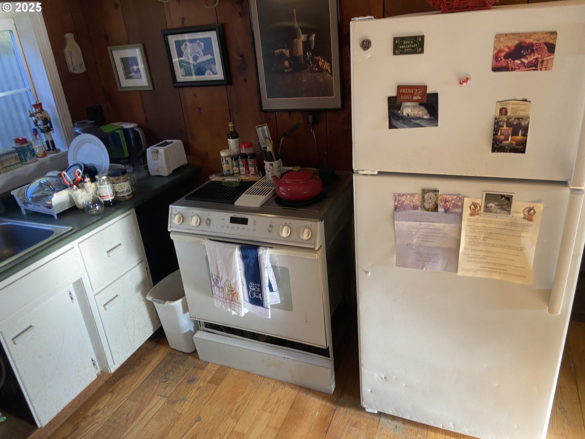 4571 Perpetua Street Florence, OR 97439 - Photo 8 of 13 a kitchen with stainless steel appliances granite countertop a refrigerator and a stove