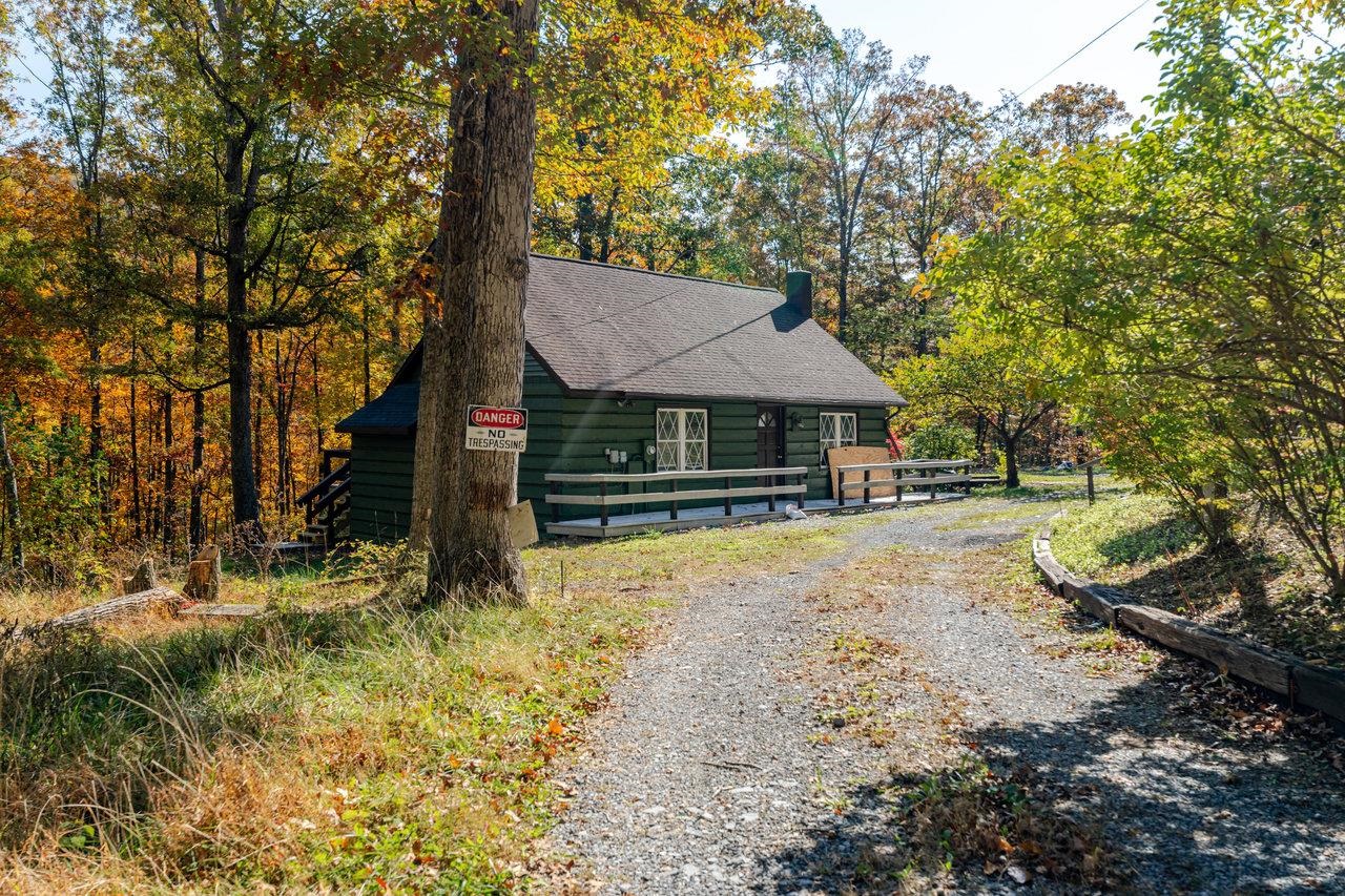 115 Risk Road Mount Jackson, VA 22842 - Photo 1 of 50 a house with trees in the background