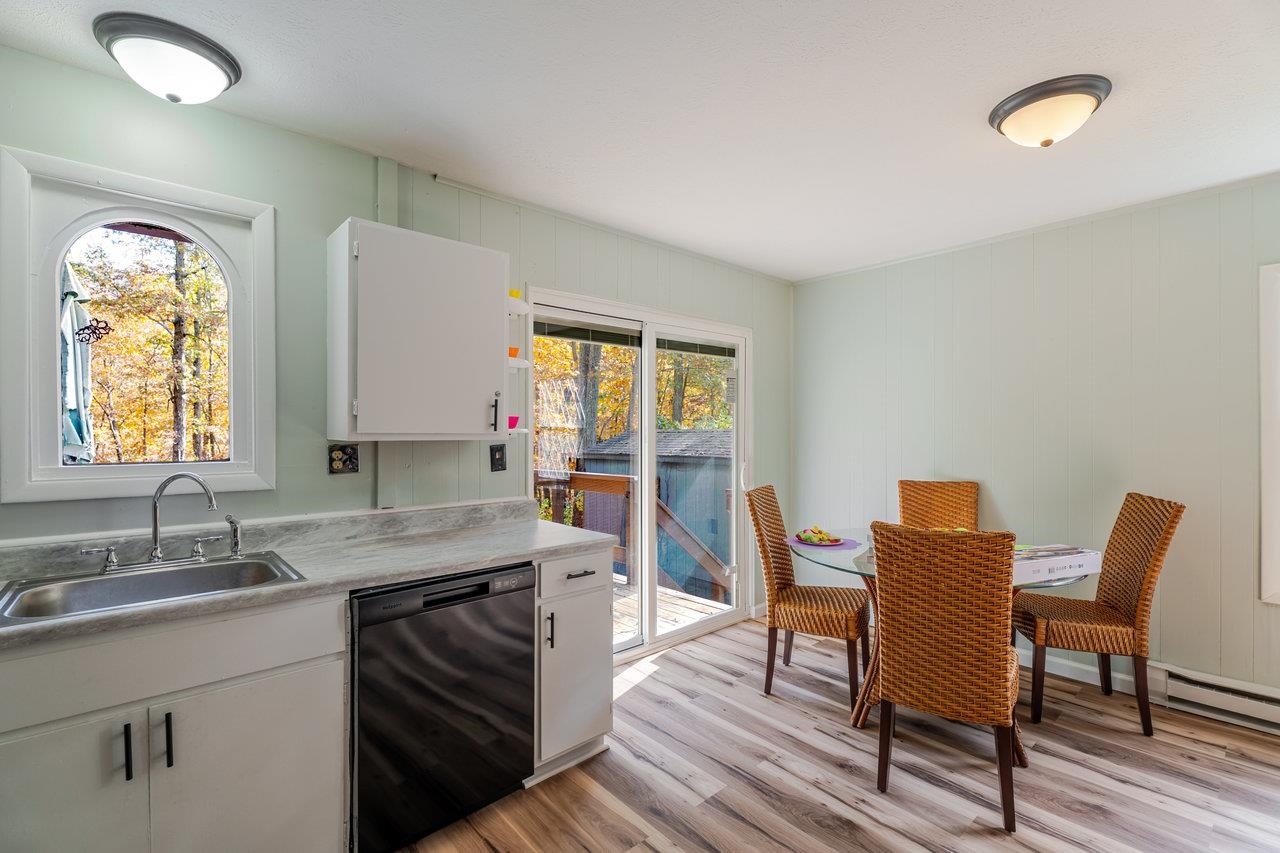 115 Risk Road Mount Jackson, VA 22842 - Photo 15 of 50 a kitchen that has a table chair and wooden cabinets