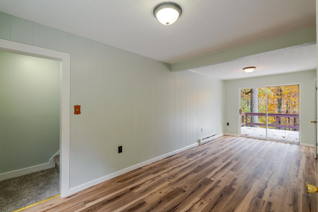 115 Risk Road Mount Jackson, VA 22842 - Photo 16 of 50 a view of an empty room with wooden floor and a window