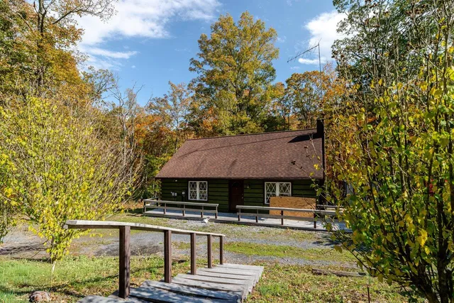 a house with trees in the background