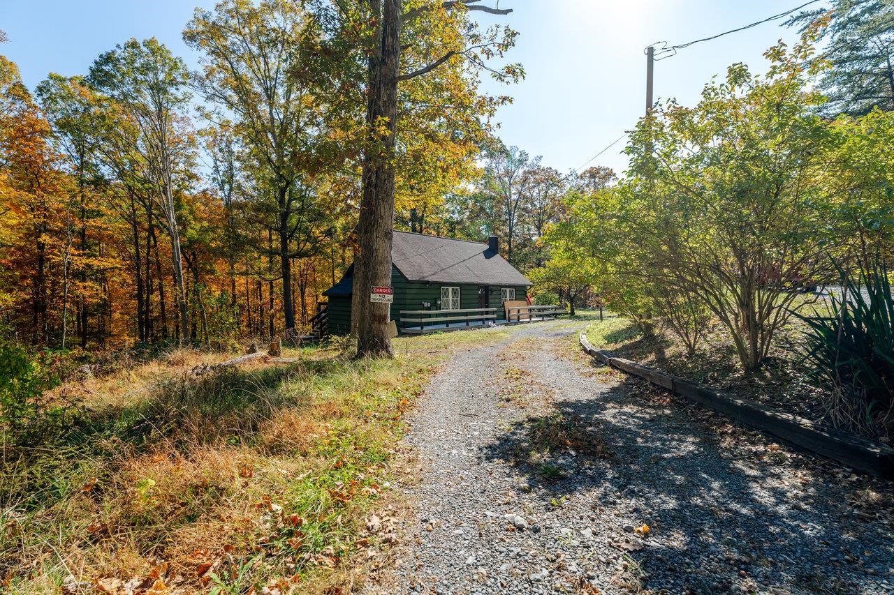 115 Risk Road Mount Jackson, VA 22842 - Photo 28 of 50 a front view of a house with a yard and garage
