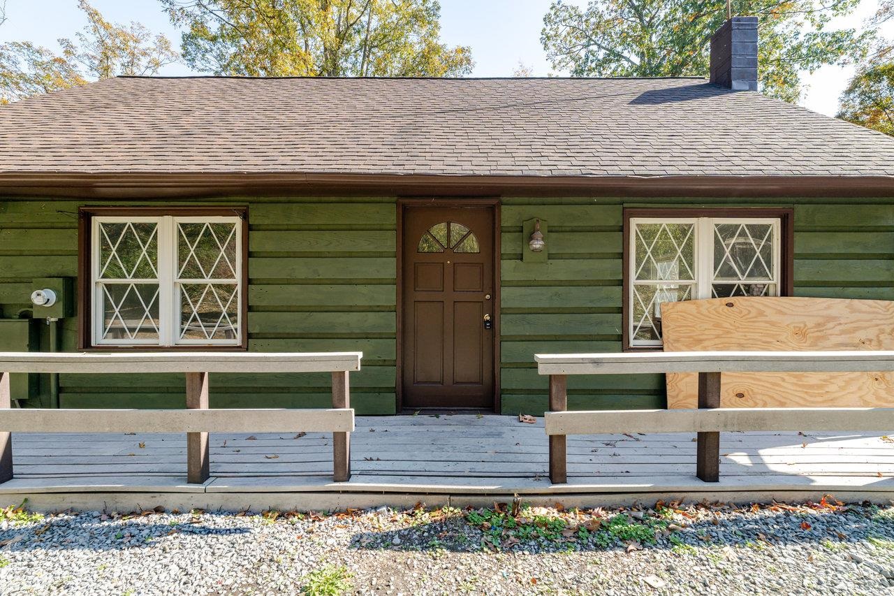 115 Risk Road Mount Jackson, VA 22842 - Photo 3 of 50 a front view of a house with a garden