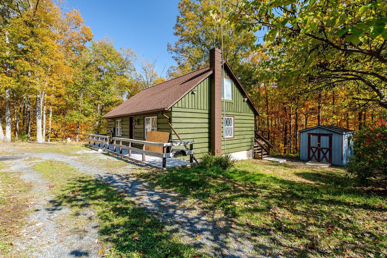 115 Risk Road Mount Jackson, VA 22842 - Photo 32 of 50 a backyard of a house with table and chairs
