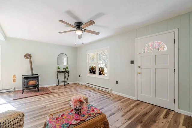 a bedroom with furniture and a window